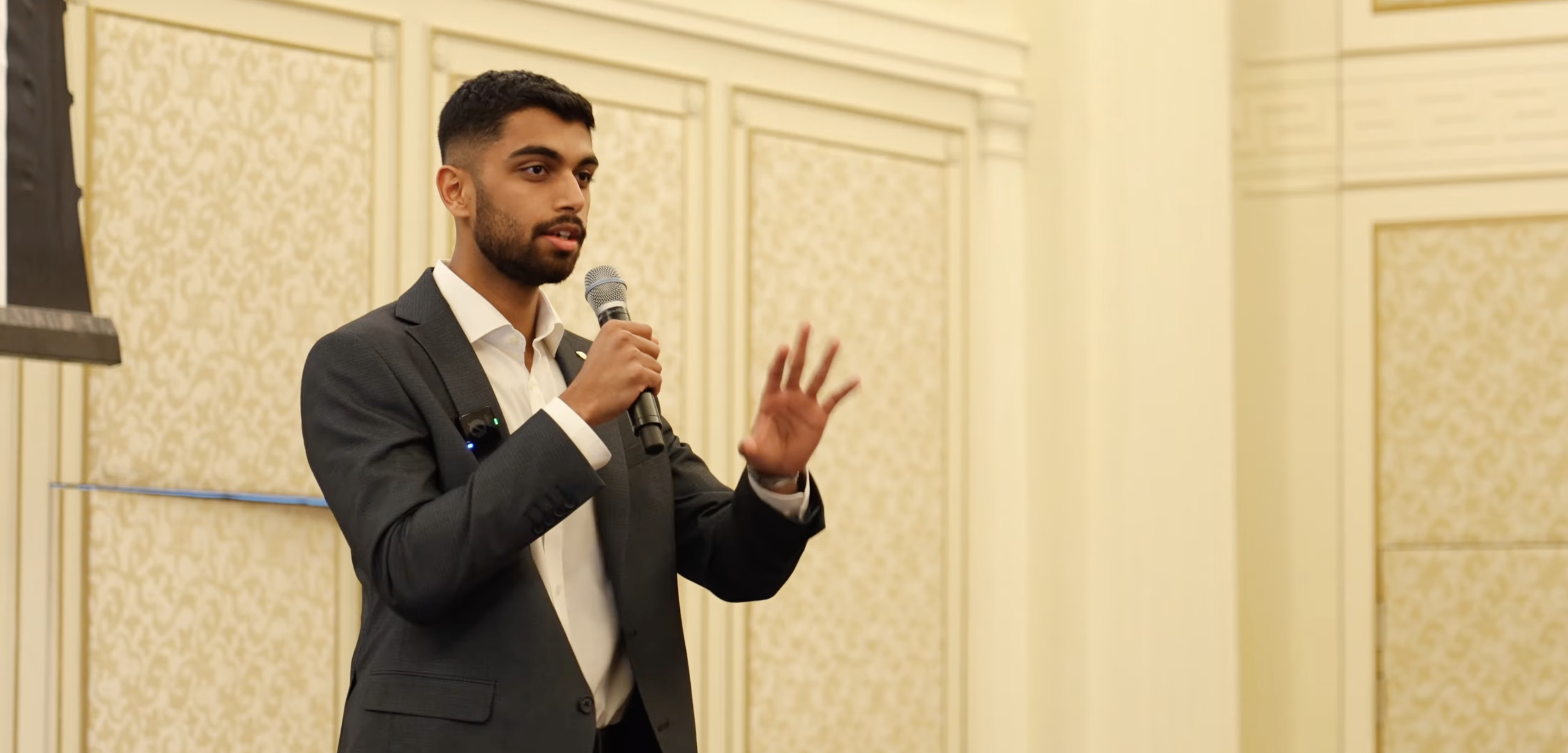 Saad Shaikh speaking on stage